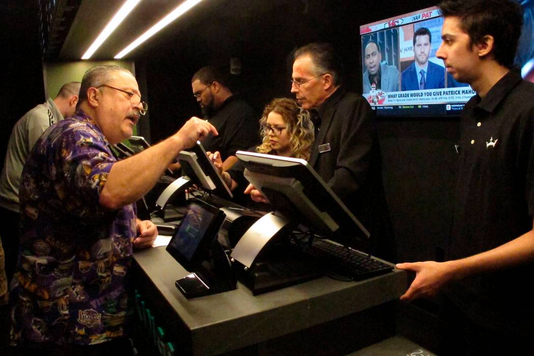 Man placing bet at sportsbook