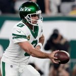 Aaron Rodgers hand s off the ball - AFC East preview - professional handicappers