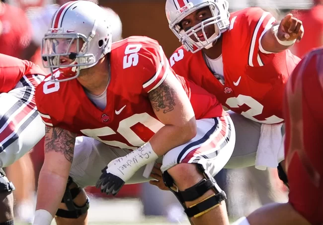 College footbll rules - why is the guard allowed to move to tap the center?