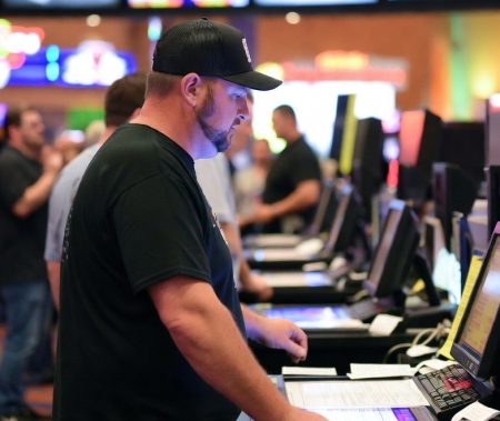 Man places bet at sportsbook