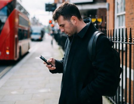 guy betting on his phone in London